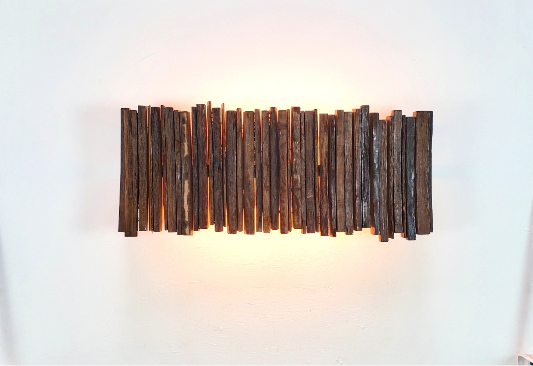 Reverse Nellio wine barrel wall sconce, illuminated front view